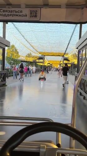 Evening amusement activities along Kazan's illuminated waterfront promenade
