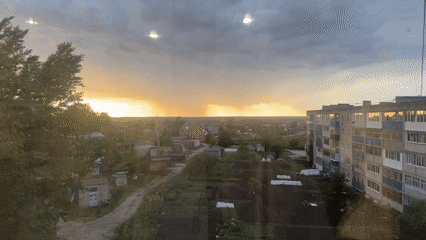 Dramatic storm clouds and orange glow observed over Chamzinka