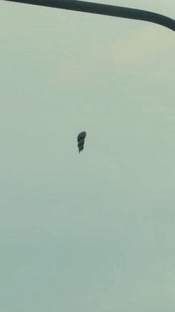 Parachutist spotted descending over Khimki, Russia