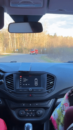 Fire truck passes through intersection in Niva, Russia
