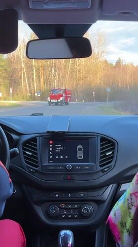 Fire truck passes through intersection in Niva, Russia