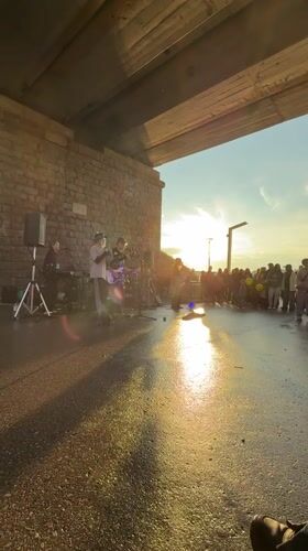 Family enjoys evening outing at Perm embankment with music, art