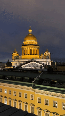 Saint Petersburg's illuminated neoclassical skyline on a wet night