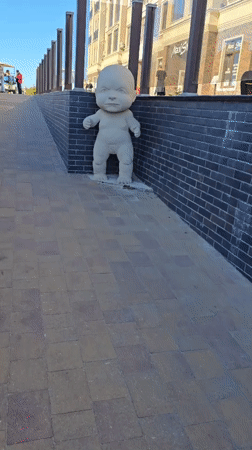 Food festival draws crowds near baby sculpture installation in Zelenogradsk