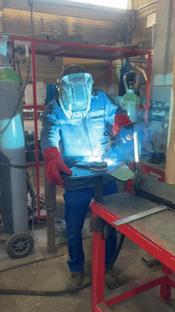Welder works on metal piece in Montenegro workshop