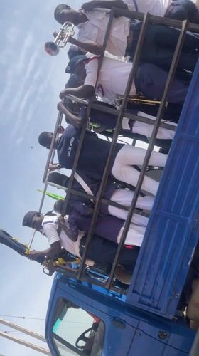 Parade band travels in caged truck bed in Nigeria