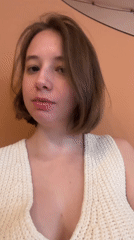 Woman in white top filmed in close-up, Tbilisi