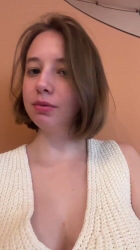 Woman in white top filmed in close-up, Tbilisi