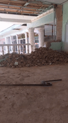 Demolition site work, mid-morning, with a casual camera moment