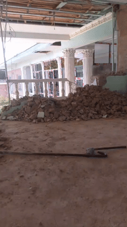Demolition site work, mid-morning, with a casual camera moment