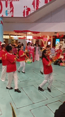 Women perform synchronized dance routine in Da Lat mall