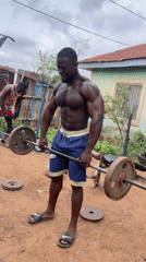 Man conducts outdoor weight training in Akwanga, Nigeria