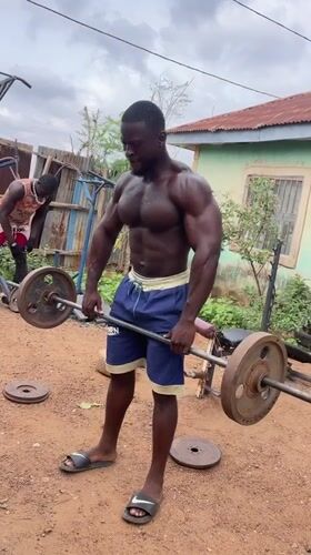 Man conducts outdoor weight training in Akwanga, Nigeria