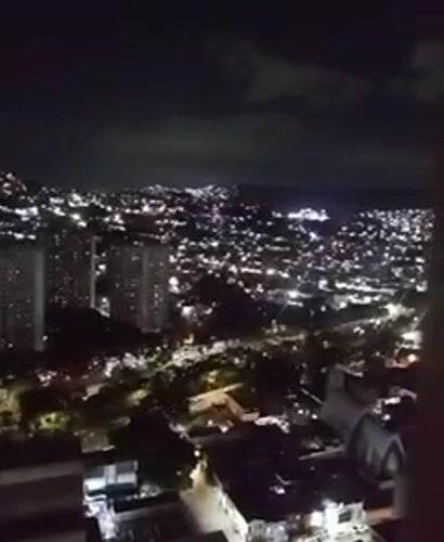 Evening scenes captured in Caracas: cityscape and sewing