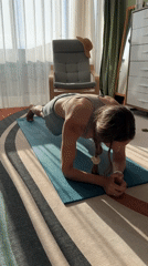 Woman conducts early morning yoga workout in Fethiye home