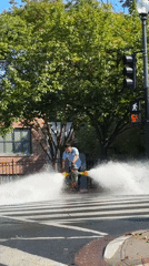 Man operates fire hydrant in Washington crosswalk