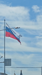 Russian flag flies over Goryachiy Klyuch street scene