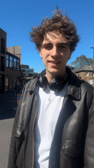 Young man enjoys sunny afternoon pint at London Wetherspoons