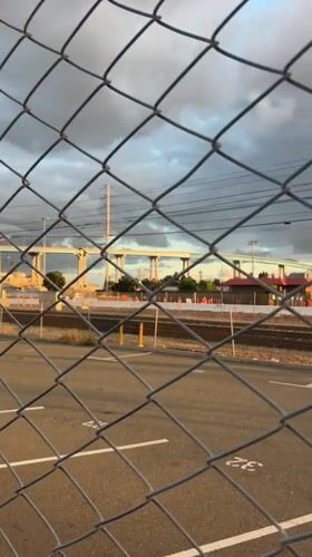 Empty numbered parking lot observed near San Diego train tracks