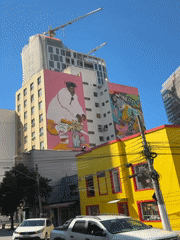 Psychedelic street murals covering São Paulo building facades