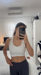 Woman takes morning selfie in bedroom mirror, Holon
