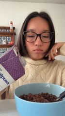 Woman eats chocolate cereal breakfast in Puebla, Mexico