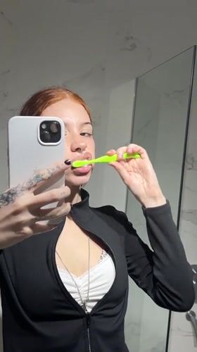 Woman records herself brushing teeth in Buenos Aires bathroom