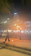 Fire dancer performs for beachgoers in Nha Trang