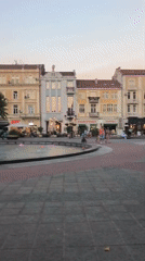 Summer evening around Plovdiv's lit central fountain