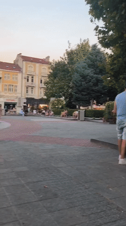 Summer evening around Plovdiv's lit central fountain