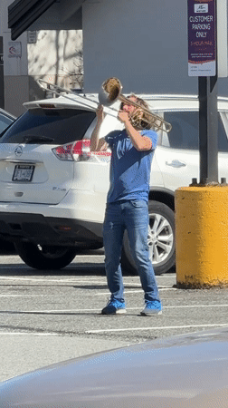 Late-night trombone performance in North Vancouver parking lot