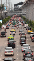 Bangkok highway gridlock with monorail passing above