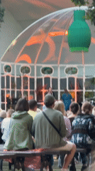 Live keyboard and vocal performance inside Riga's glass-roofed venue