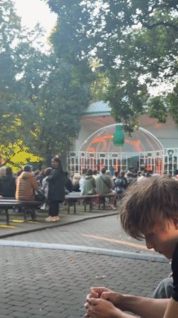 Live keyboard and vocal performance inside Riga's glass-roofed venue