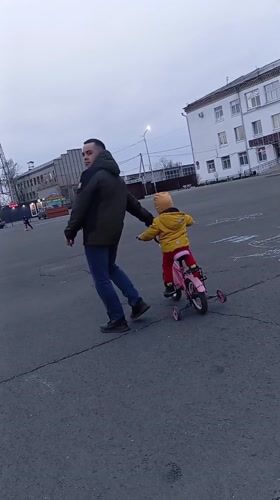Casual moments captured in Yurgamysh: father-child walk, woman's selfie