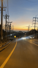 Dusk sky over a Karon road, warm gradient on the horizon