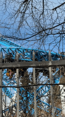 Amusement park rides captured through fence in Saint Petersburg
