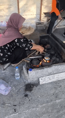 Roadside cooking and caged birds at a Karanganyar outdoor spot