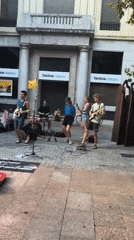 Street band plays outside a bank in Vitoria-Gasteiz