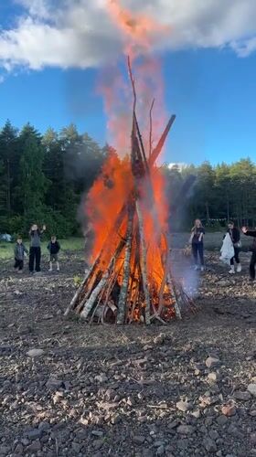 Bonfire gathering in the woods near Soanlakhti, Russia