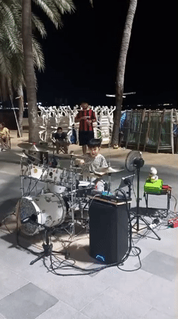 Night market activity and street performances documented in Pattaya