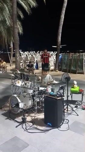 Night market activity and street performances documented in Pattaya