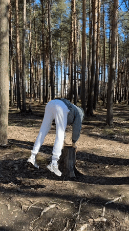 Person exercises and relaxes in Russian pine forest