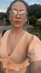 Woman walks residential street during golden hour in Podgorica
