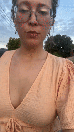 Woman walks residential street during golden hour in Podgorica