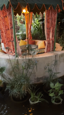 Woman documents visit to floral-decorated venue in Denpasar