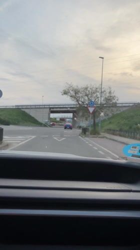 Routine traffic movement captured at Alcolea roundabout during evening commute
