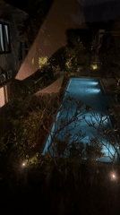 Nighttime pool scene captured in Kuta Selatan, Indonesia