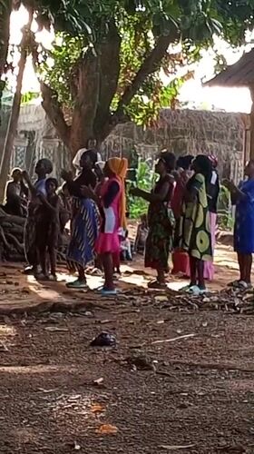 Village gathering in Akwanga with dancing, procession, and communal ceremony.