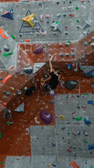 Women practice indoor rock climbing in Krasnoyarsk gym
